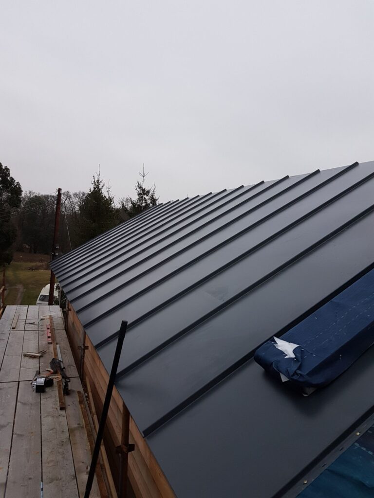 Metal roof installed on our SIPs home construction